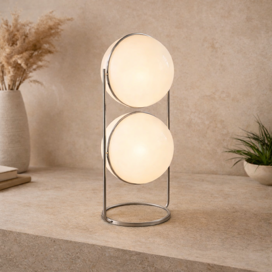 Modern table lamp with two glass spheres on a neutral background