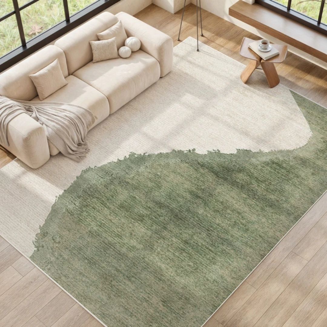 Living room with a beige sofa and a green rug on wooden flooring.