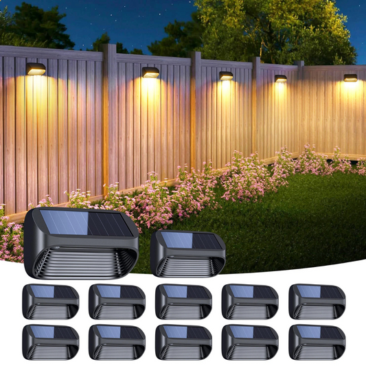 Solar-powered outdoor lights on a wooden fence with flowers and trees in the background.