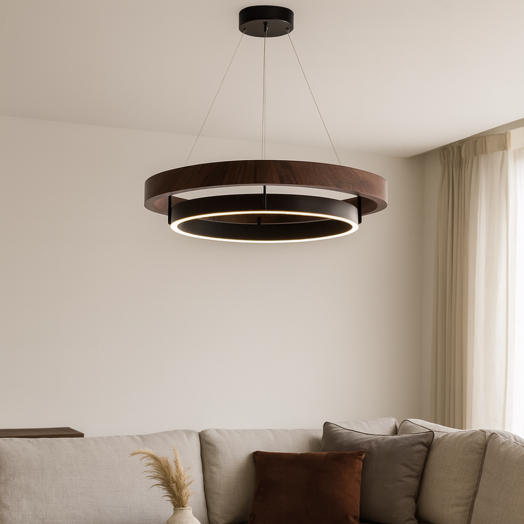 Modern pendant light hanging above a sofa in a living room.