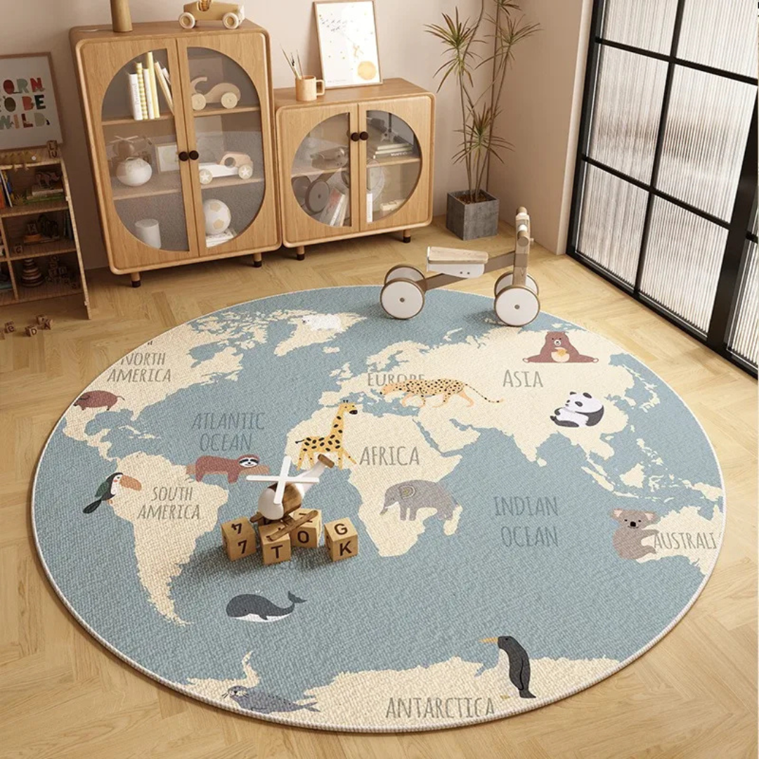 Round world map rug on a wooden floor with children's toys around