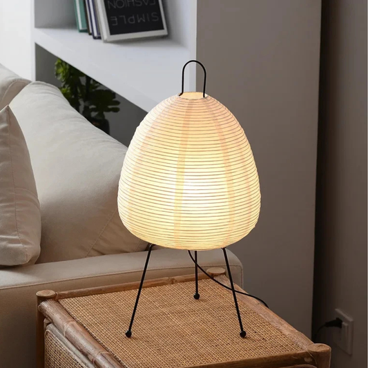 Woven table lamp on a side table in a living room setting