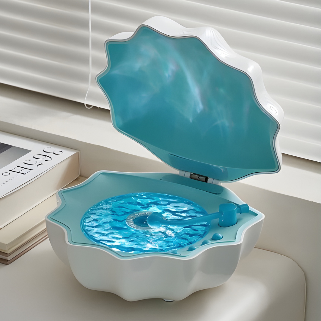 Shell-shaped pet water bowl with blue water on a light background